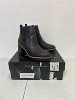 Side view of both boots on box