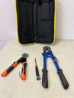 All items: two bolt cutters, screwdriver, case