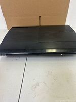 Front angled view of PS3 Super Slim console