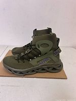 Side view of both sneakers showing overall design, color, sole