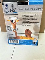 Retail box front detailing Sight Bulb Pro smart camera & light features