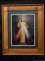 Front view of framed Divine Mercy of Jesus print with oak-tone frame and heart carvings
