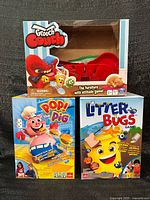 All three boxed games stacked for overview.