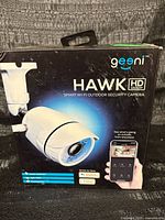 Front of Geeni Hawk camera retail box showing product image and specs