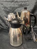 Group shot of both percolators and thermal carafe with power cord