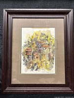 Full view of framed watercolor painting in dark wood frame