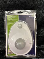 Front view of sealed Leviton LED Ceiling Occupancy Sensor Lampholder package