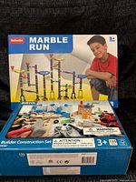Front of BeeBeeRun Marble Run box and BRIO Builder Construction Set box