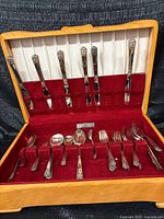 Open chest showing full flatware set