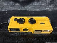 Top view showing Minolta Weathermatic A body, exposure and focus dials, flash window