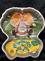 Front view with original cardboard insert showing Cabbage Patch Kids graphics