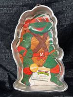 Front view with colorful insert sheet inside pan