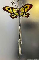 Full view of butterfly wind chime hanging