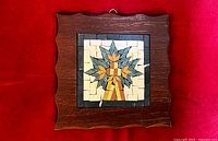 Front view of framed mosaic artwork