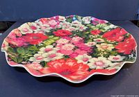 Top view showing full floral pattern and ruffled edge of serving tray