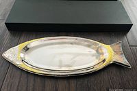 Fish-shaped silver and gold plated serving tray front view