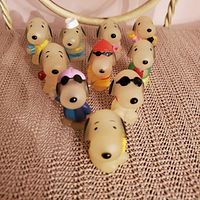 Front view showing all ten Snoopy pencil toppers lined up