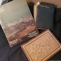 All three items grouped: carved wood box, Map booklet, Robert Burns book