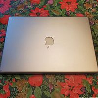 Closed Apple PowerBook G4 showing silver lid with logo