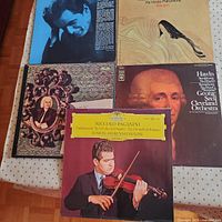 All five record jackets displayed on table