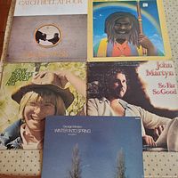 Five album covers laid out