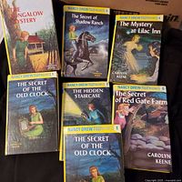 All six Nancy Drew first-edition volumes laid out, covers visible