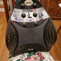 Front view showing molded plastic frame, mesh panel and branding