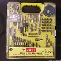 Front view of sealed Ryobi 60-piece drilling and driving kit showing contents layout