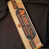 Acme De Luxe cribbage board box showing branding and graphics