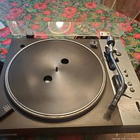 Overall view of Pioneer PL-510A turntable showing plinth, platter without mat, dust cover, tonearm