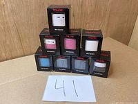 All eight boxed mini speakers stacked