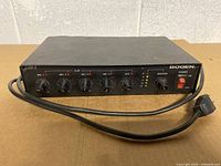 Front view showing all control knobs, indicators and power cord