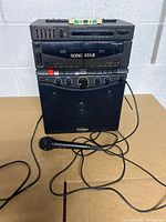 Full view of Casio Song Star karaoke unit with speaker and microphone