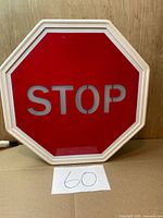 Front view of octagonal red stop sign with white frame