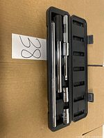 Open case showing breaker bar, extension, three sockets