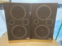 Front view of both Fisher speakers with grills on