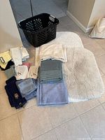 Group shot showing towels, rugs and basket