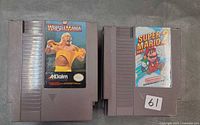 WrestleMania and Super Mario Bros. 2 cartridges front view