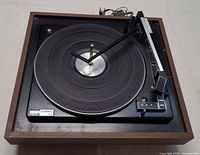 Top view of BSR McDonald 1410 turntable showing platter, tonearm and wooden plinth