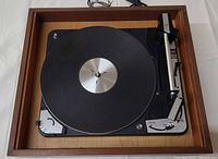 Top view of Dual 1010 turntable in wood plinth