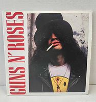 Front cover showing Slash portrait and band name