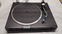 Top view of Sansui FR-D35 turntable showing platter, tonearm and dust cover