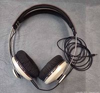 Overhead view of headphones with attached cable and 3.5 mm plug