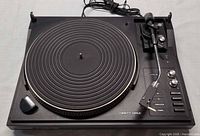 Top view of Telefunken TS 860 turntable showing platter, tonearm, control panel and power cord