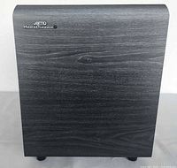 Front view showing logo and wood-grain finish