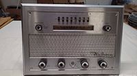 Front view of Nutone Model 2015 intercom showing full faceplate, speaker grille, knobs and buttons