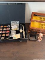 Overview showing organiser case, watches, wood chest, trinket boxes