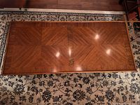 Top view of rectangular wood veneer coffee table showing geometric grain pattern