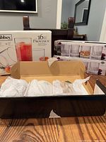 All boxes shown: Libbey 16-piece set, two sealed Bacon Hill Crystal boxes, one opened Bacon Hill box with wrapped glasses