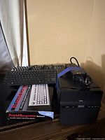 Group shot showing NAS, IBM keyboard box, two keyboards